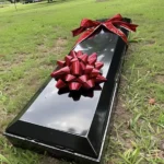 A coffin with a gift bow was brought to our wedding during the ceremony – I nearly fainted when it was opened